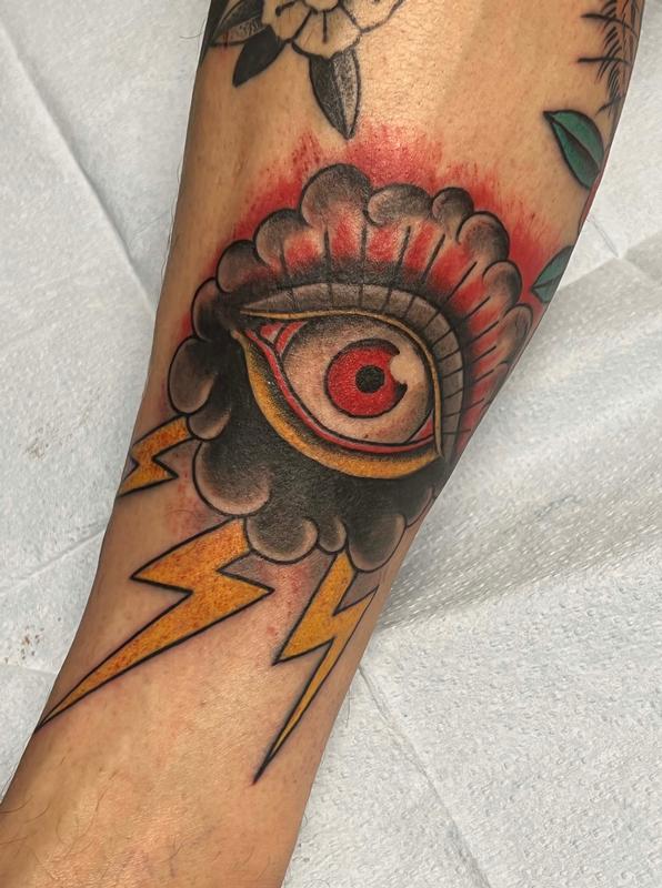 Eye with cloud and lightning