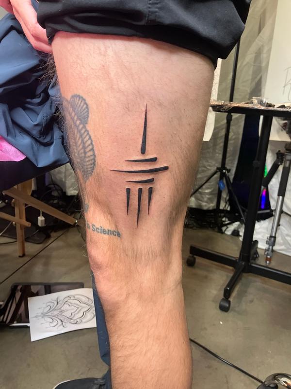 Thigh tattoo