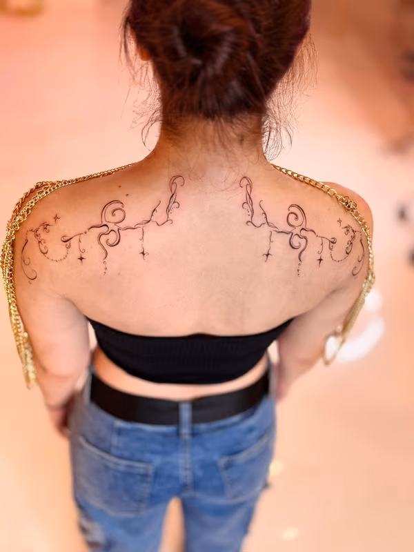 Ornamental Shoulder Blade Tattoos