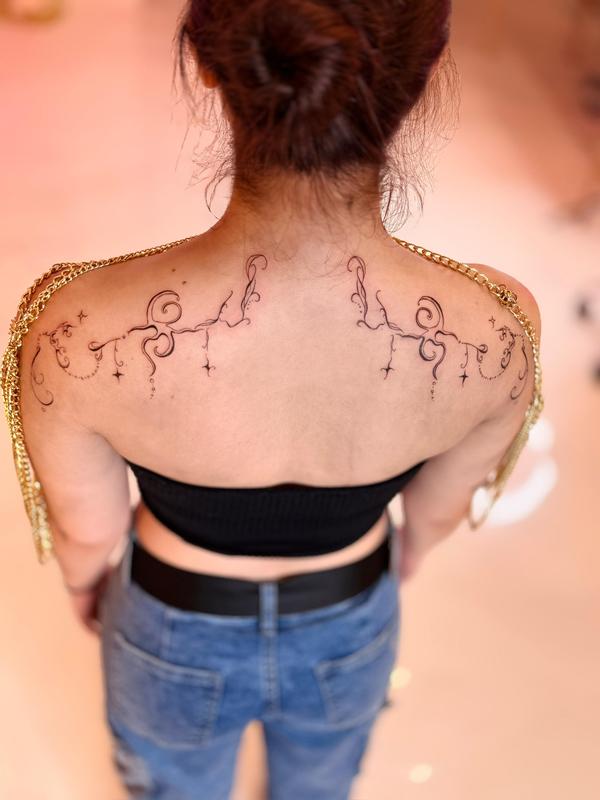 Ornamental Shoulder Blade Tattoos