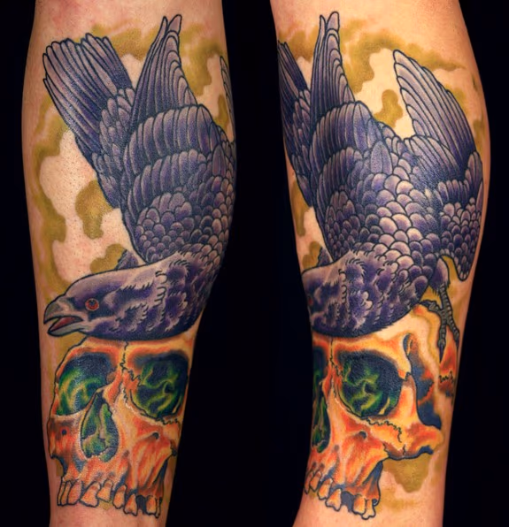 Raven and skull shin tattoo