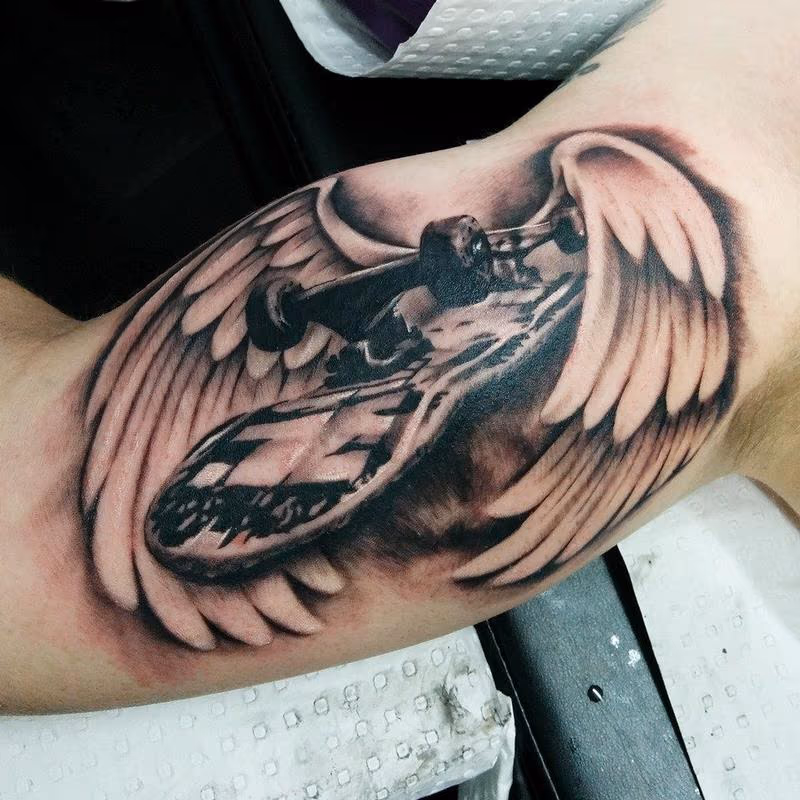 skateboard with wings on bicep