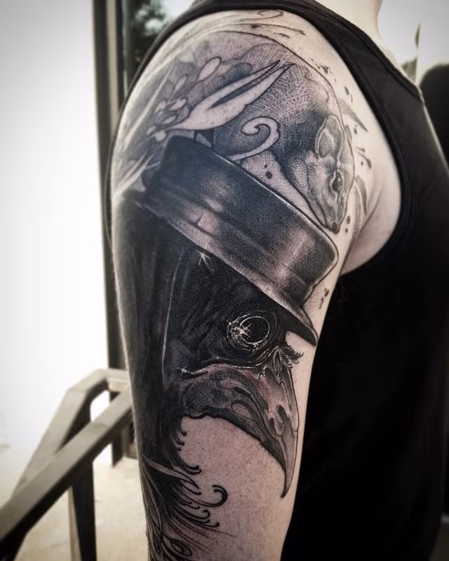 Black bird, top hat, rat, plague disease, black and grey blackwork arm
